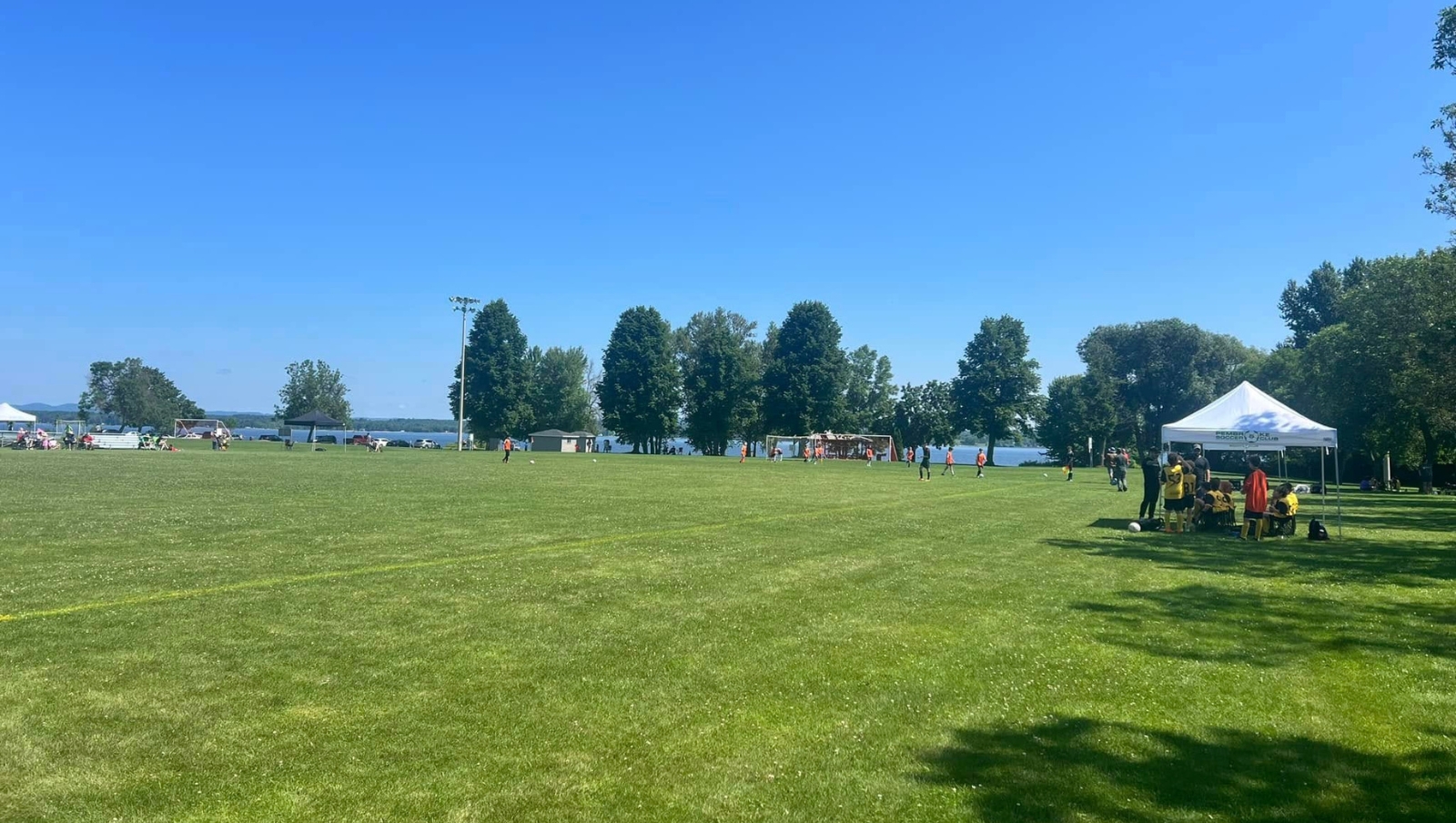 A soccer field on a summer day.