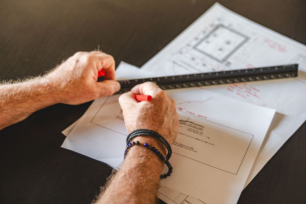 Hands on a set of plans.