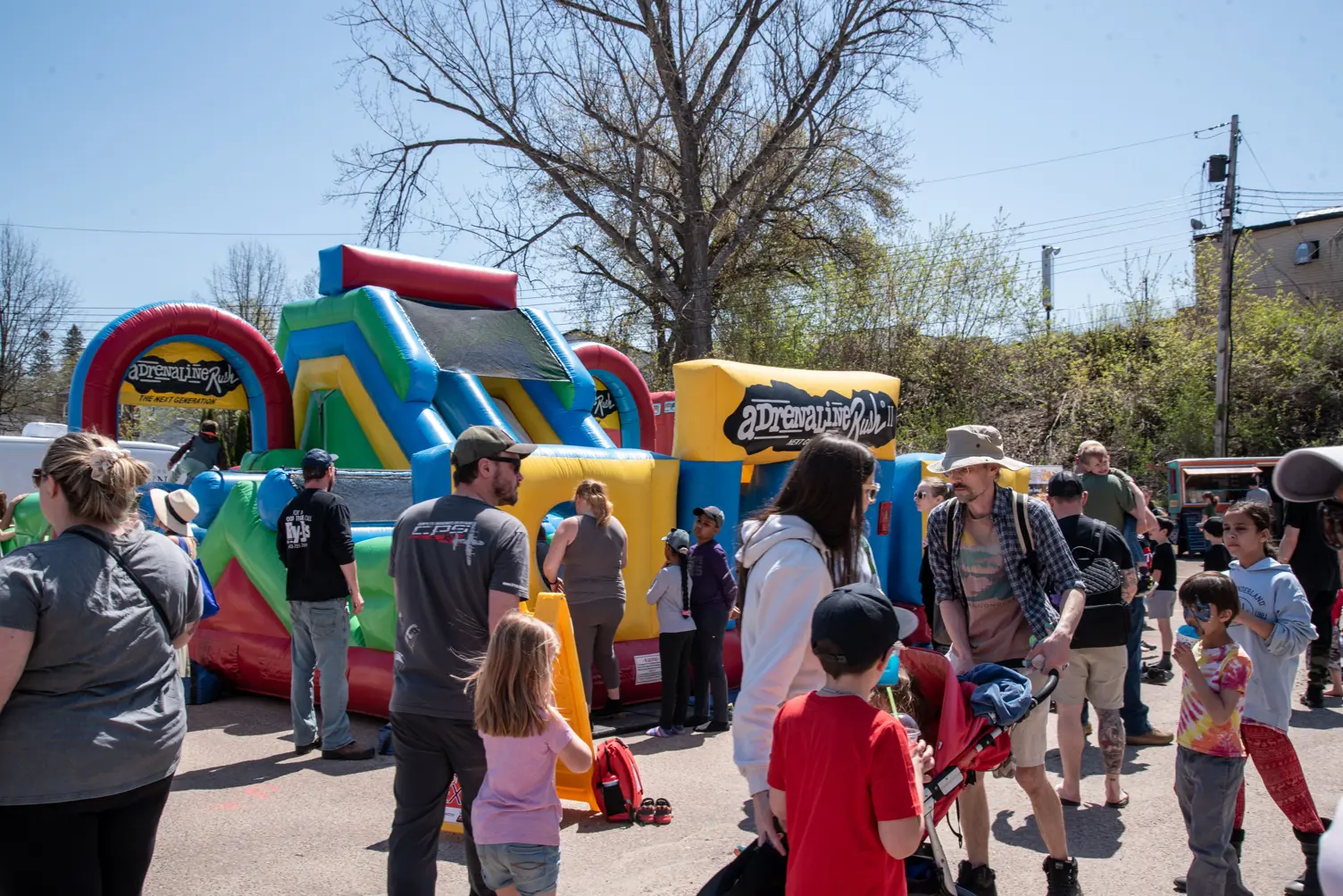 A crowd at an inflatable bouncer.