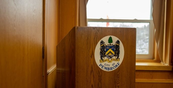A photo of a podium within Council Chambers in Pembroke City Hall.