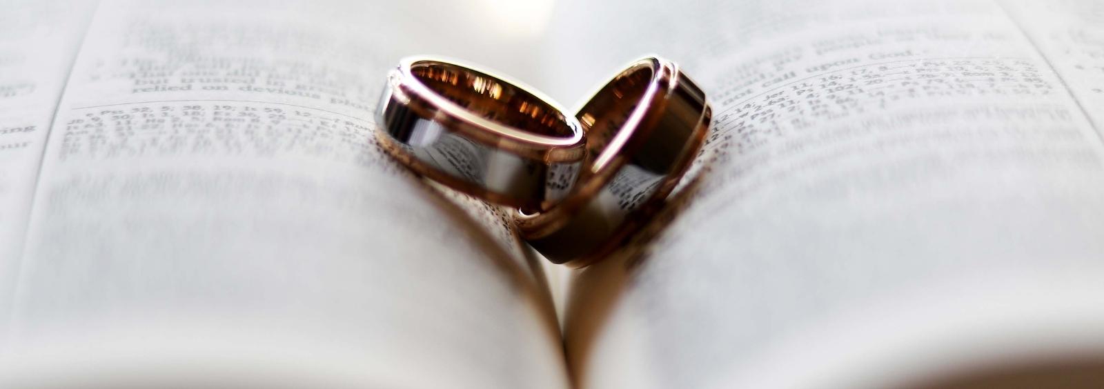 Two wedding bands placed together.