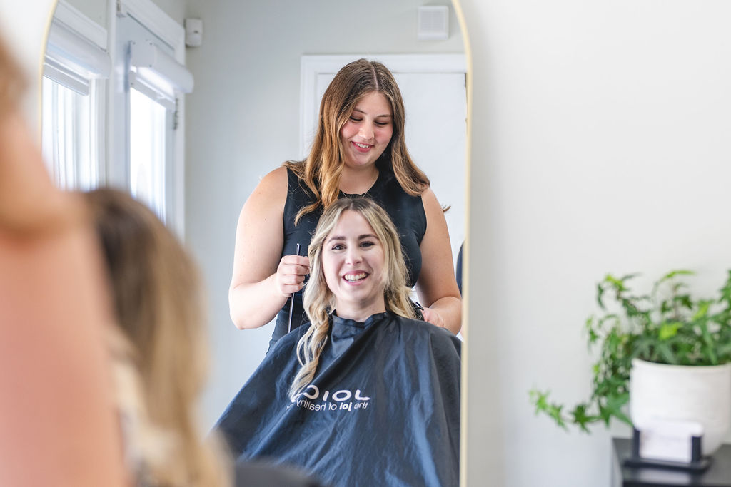A woman getting her hair done at a salon.