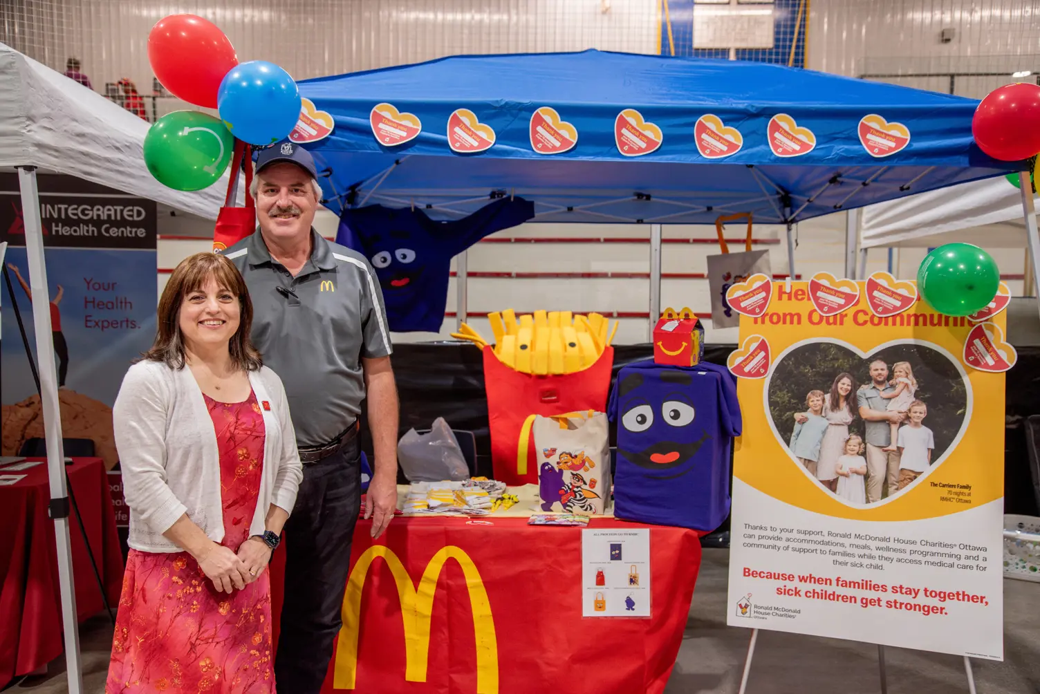 People in front of a McDonald's booth.