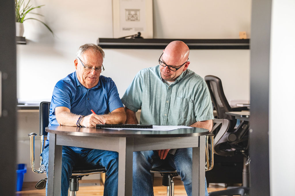 Two people working at a table